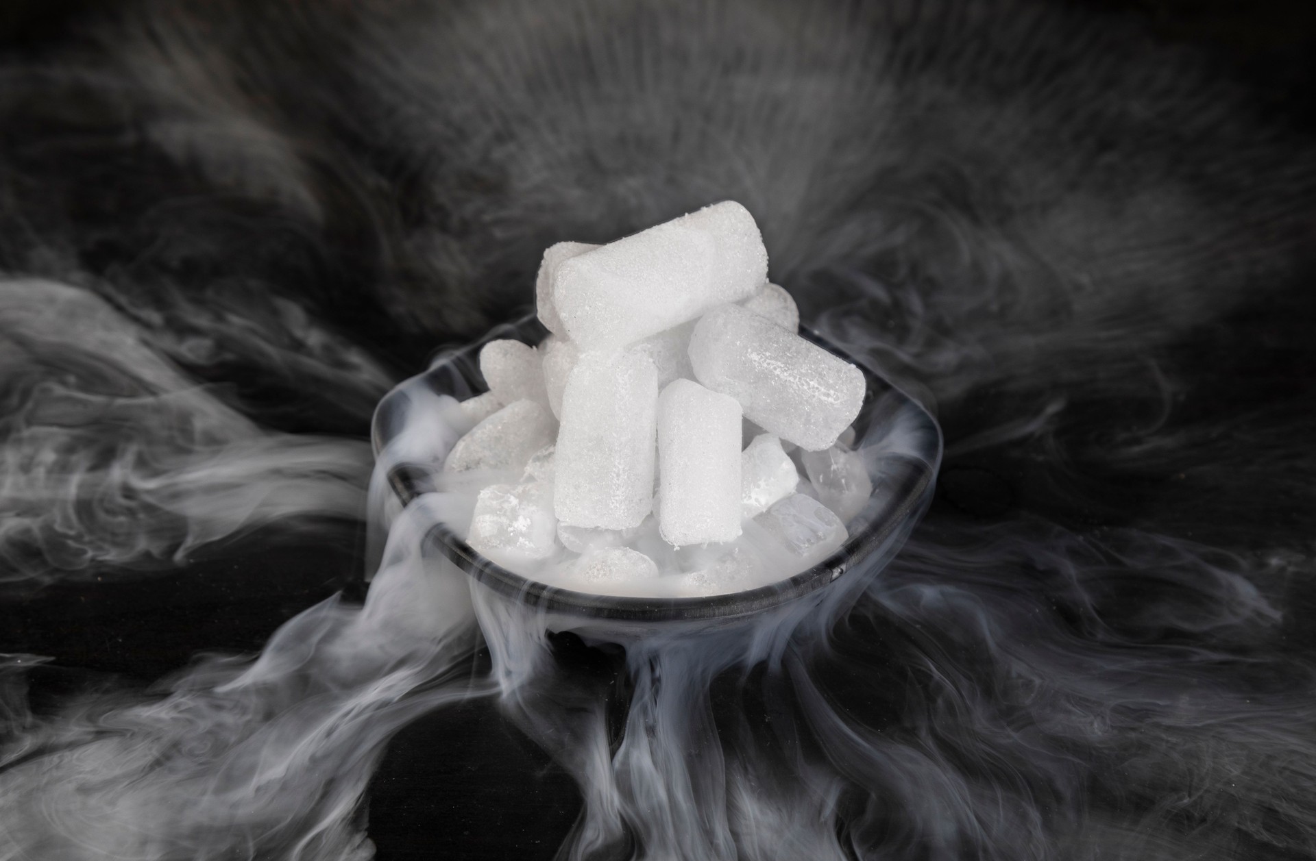 Dry ice with fog on a black background